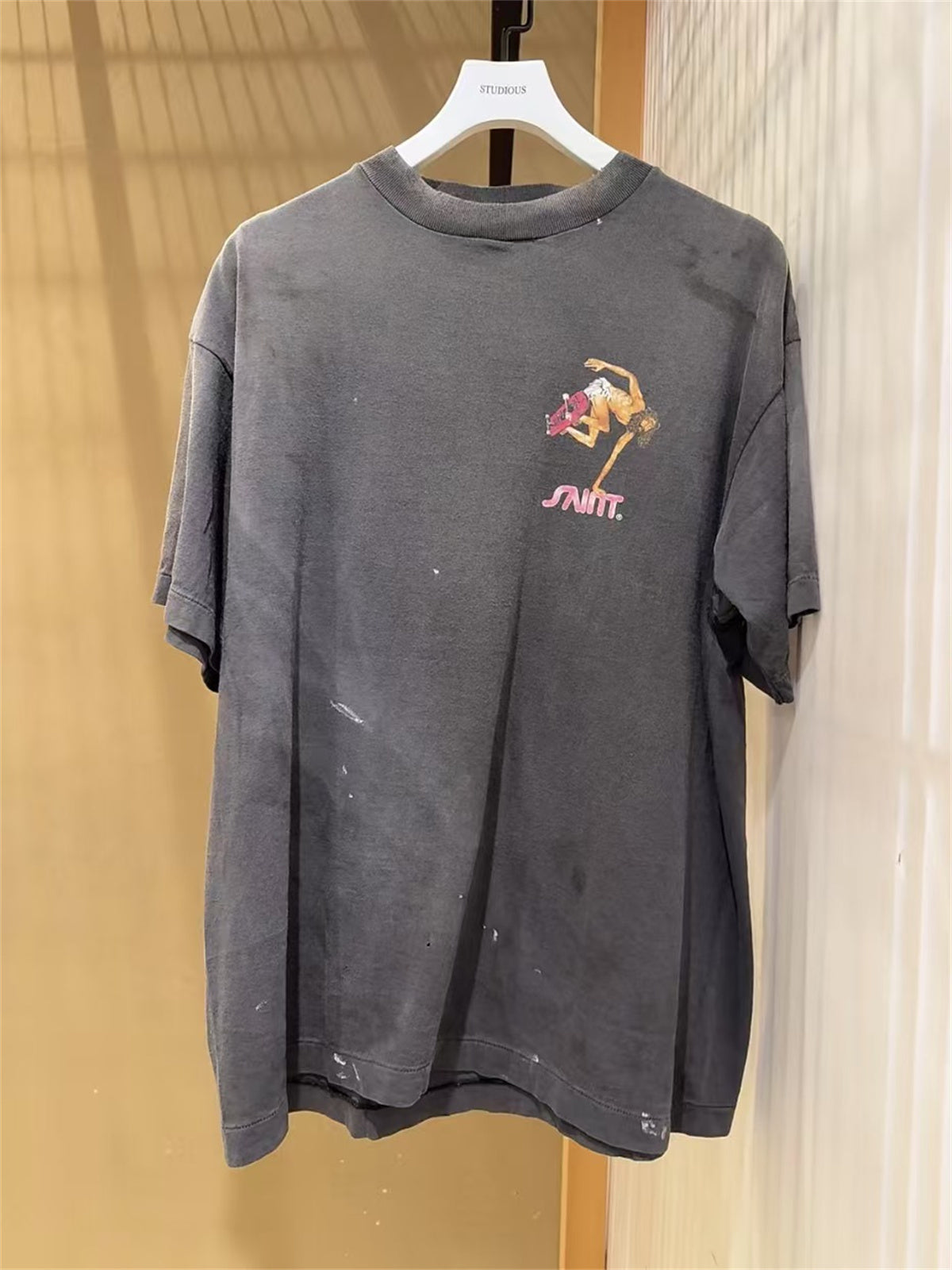 MSAINTM Skateboard-Riding Jesus Front and back Conley-style prints; washed, distressed, tubular-knit T-shirt.