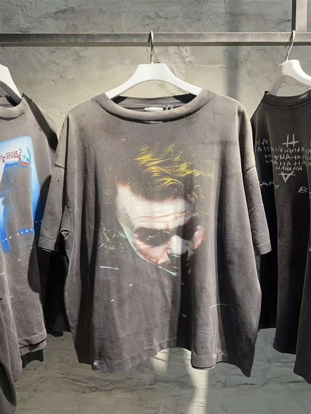 SAINT Mxxxxxx piece: Batman collaboration distressed T-shirt featuring a sun-faded gradient wash.