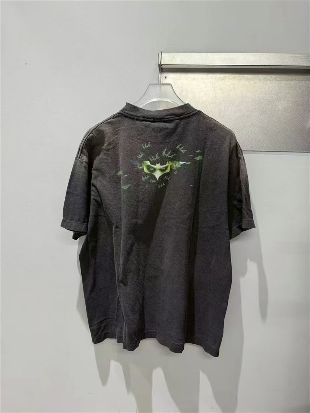 SAINT Mxxxxxx piece: Batman collaboration distressed T-shirt featuring a sun-faded gradient wash.