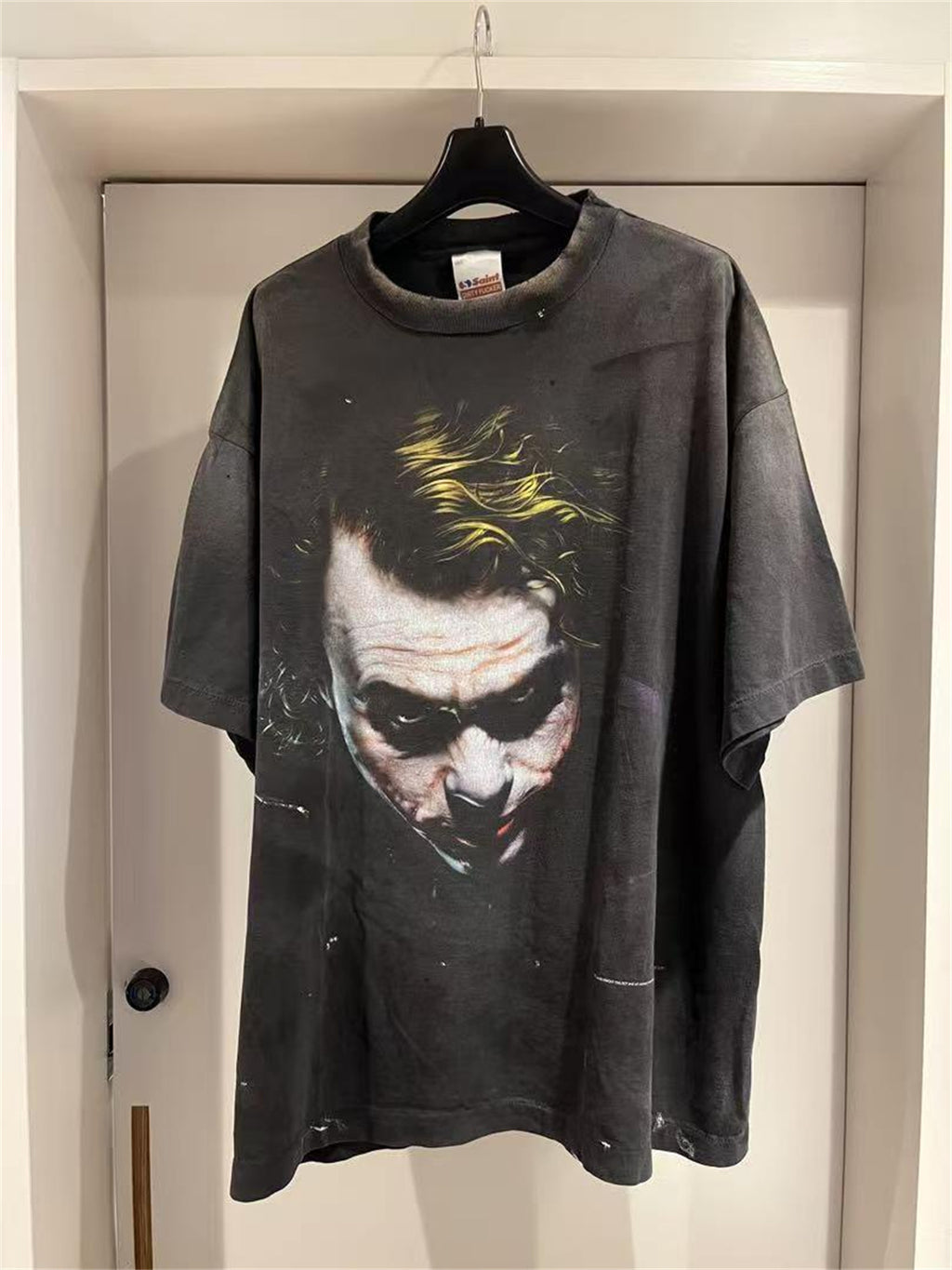 SAINT Mxxxxxx piece: Batman collaboration distressed T-shirt featuring a sun-faded gradient wash.