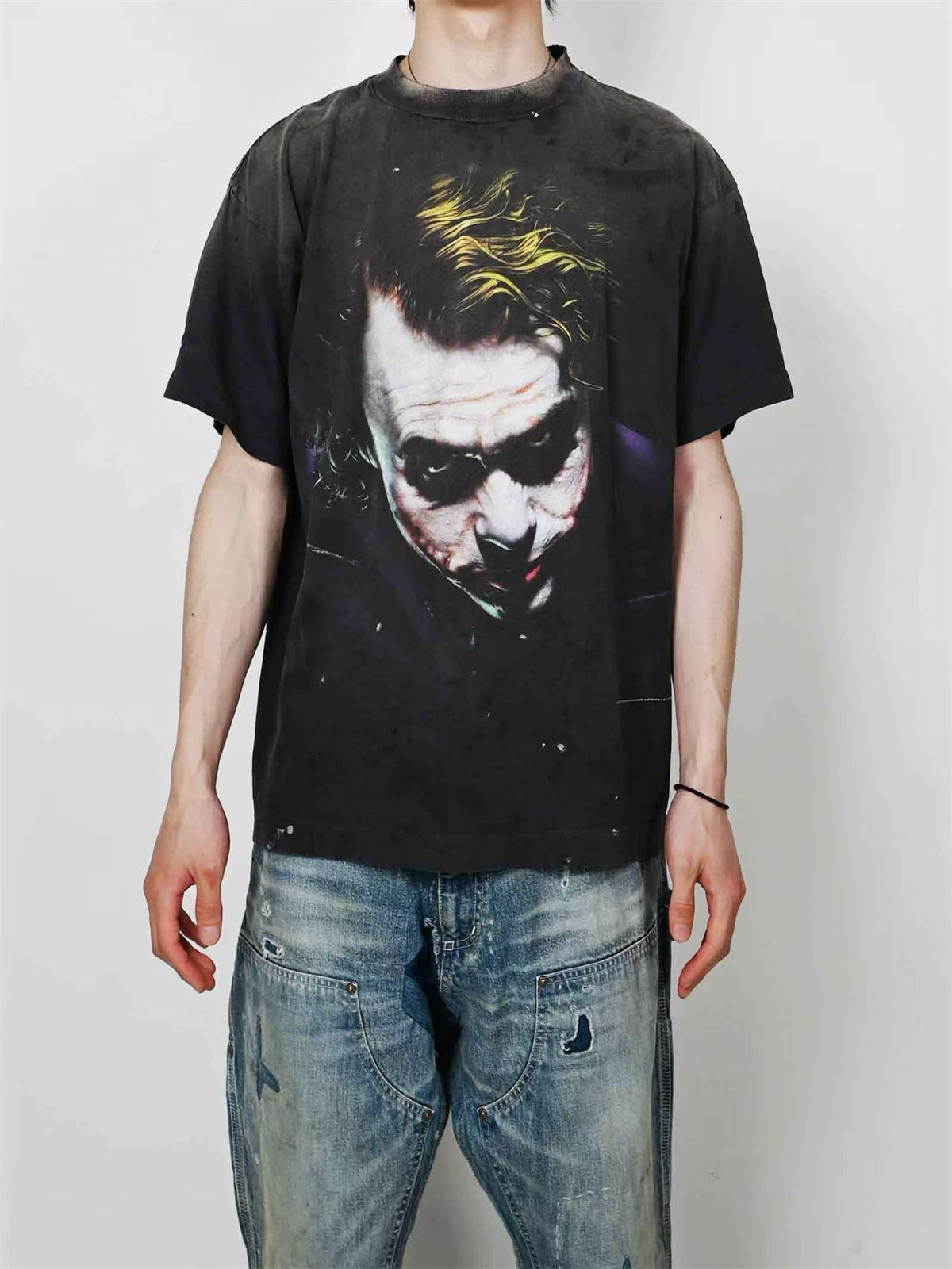 SAINT Mxxxxxx piece: Batman collaboration distressed T-shirt featuring a sun-faded gradient wash.