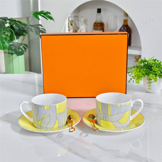 Cup and Saucer Set (Pair) – Includes matching spoons – "Yellow Track" design