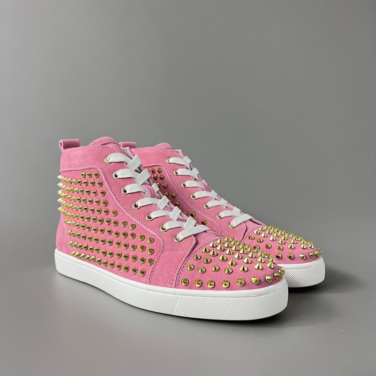 CL 【Red Sole】Lou Spikes high-top sneakers with pink-gold studs.