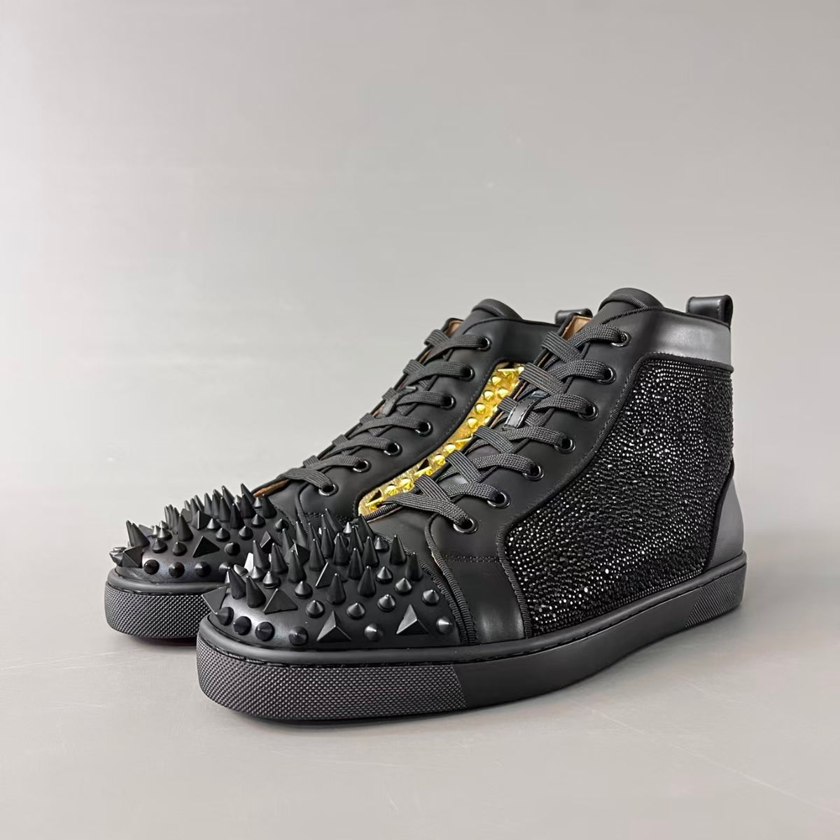 CL 【Red Sole】Lou Spikes high-top sneakers with black and gold studs.