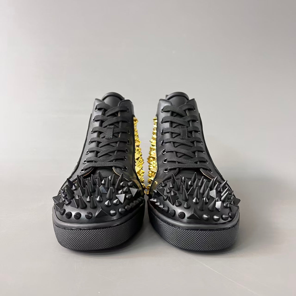 CL 【Red Sole】Lou Spikes high-top sneakers with black and gold studs.