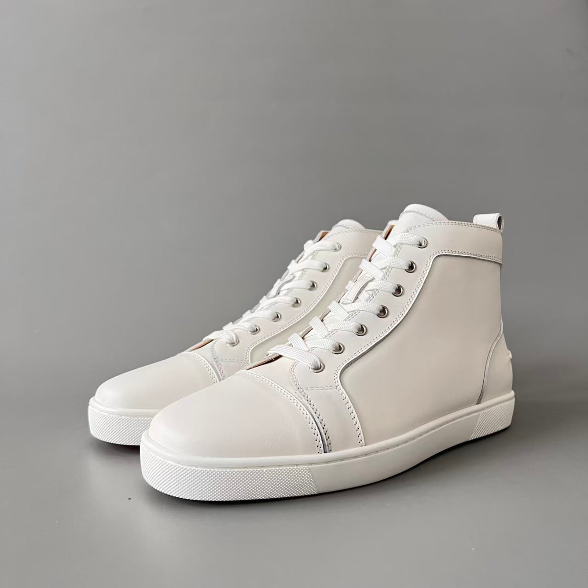 CL 【Red Sole】Lou Spikes high-top sneakers in white calfskin.