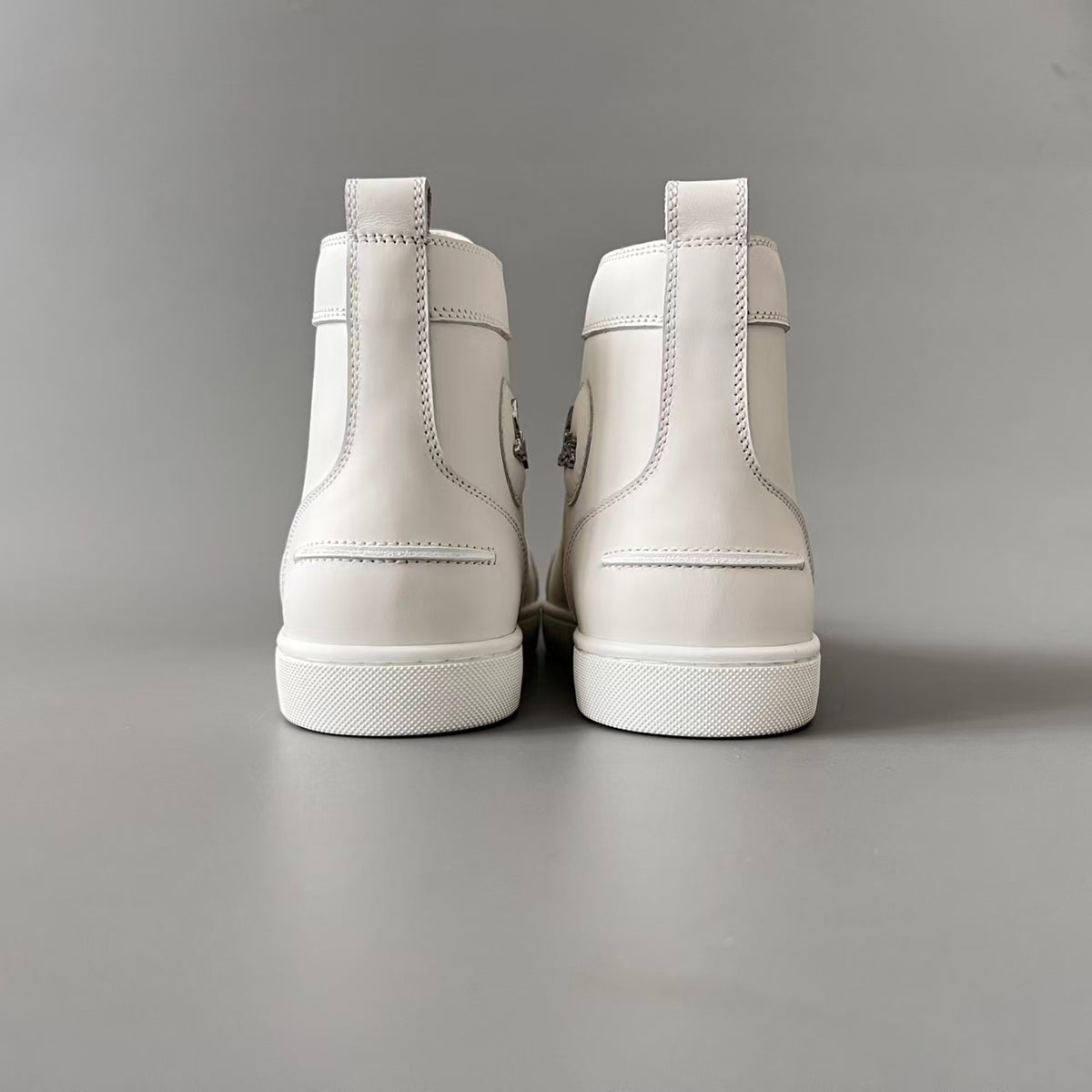 CL 【Red Sole】Lou Spikes high-top sneakers in white calfskin.